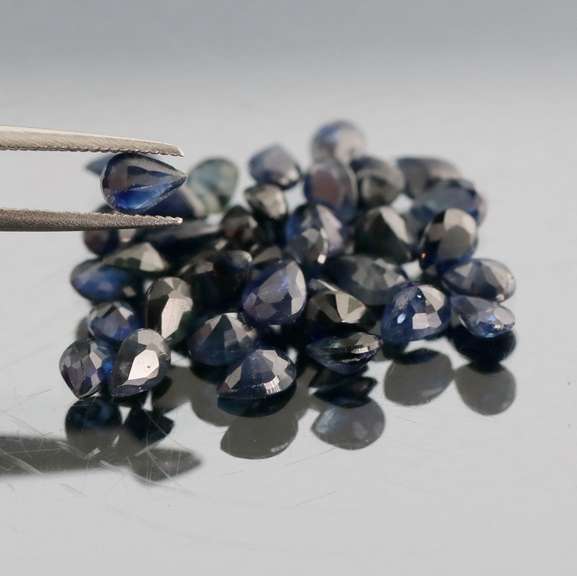 Stunning ink blue 7.14ct pear cut Sapphire set