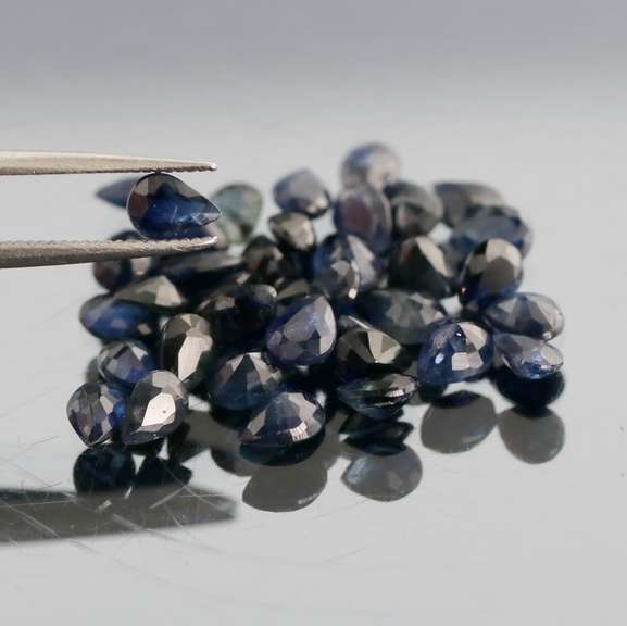 Stunning ink blue 7.14ct pear cut Sapphire set