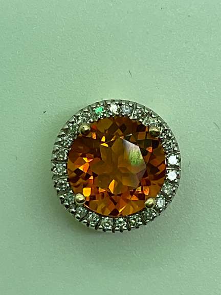 14K GOLD DIAMOND AND TOPAZ PENDANT.