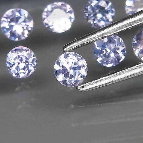 Heavy flashing 6.30ct diamond cut Tanzanite set