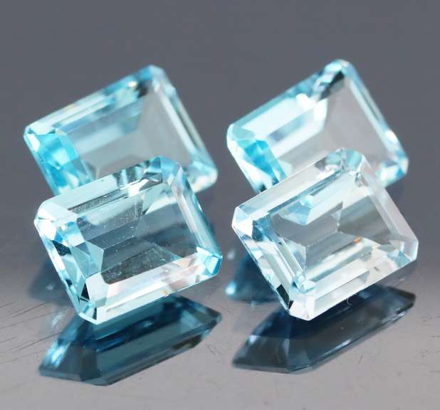 Large 14.89ct vivid blue emerald cut Topaz set