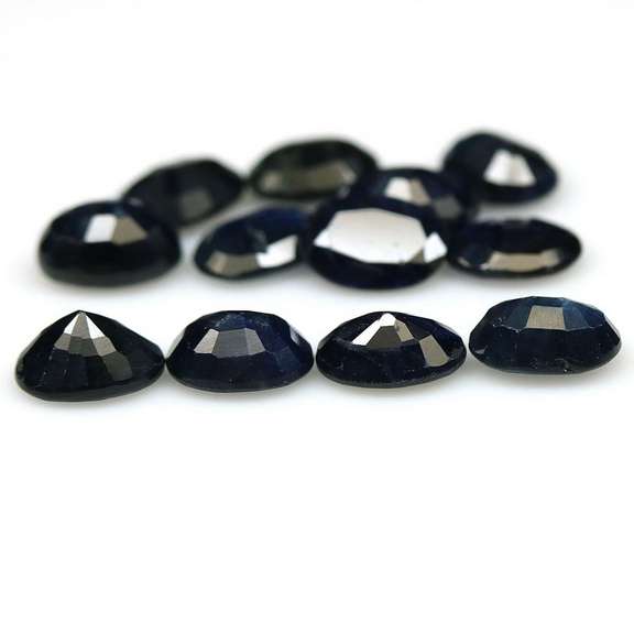 Heated only! 12.46ct dark blue Sapphire set from Madagascar