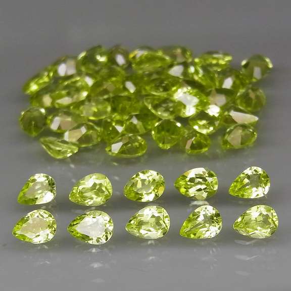 Fantastic 8.24ct 4x3mm pear cut Peridot set