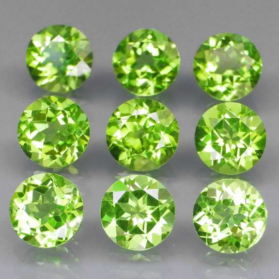 Excellent 8.26ct 6mm round cut Peridot set