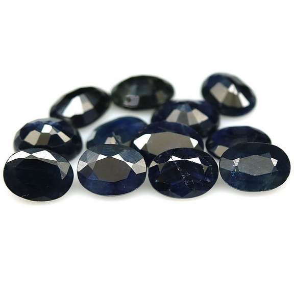 Heated only! 12.46ct dark blue Sapphire set from Madagascar