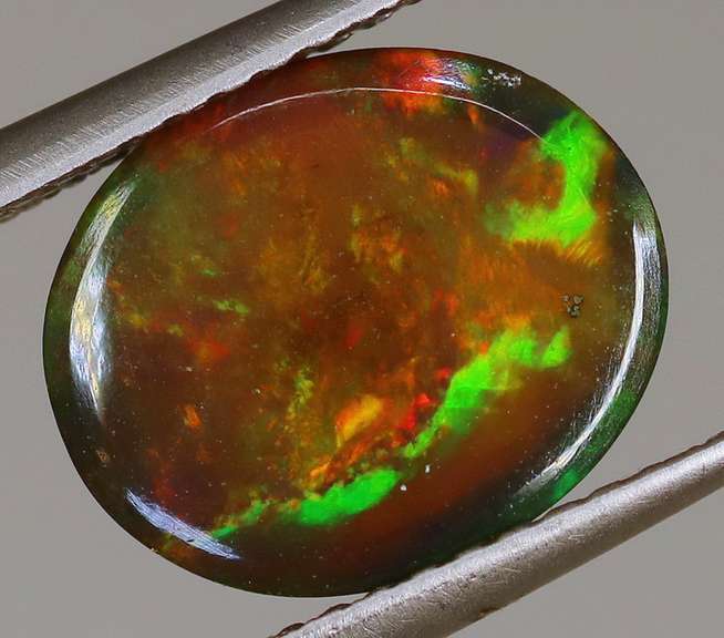Magnificent 2.05ct full body flashing Black Opal