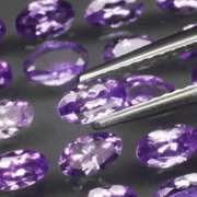 Heavy flashing 5.05ct oval cut Tanzanite set