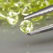 High grade 4.85ct untreated apple green Peridot set