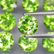 Excellent 8.26ct 6mm round cut Peridot set