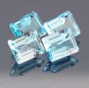 Big 16.07ct vivid blue emerald cut Topaz set