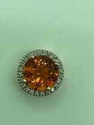 14K GOLD DIAMOND AND TOPAZ PENDANT.