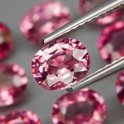 Remarkable 6.48ct violet pink Rhodolite Garnet set