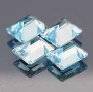 Big 16.07ct vivid blue emerald cut Topaz set
