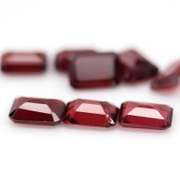 Nice 12.57ct emerald cut cherry red Garnet set