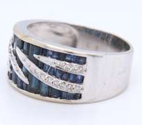 14KT WHITE GOLD BLUE SAPPHIRE & DIAMOND RING.
