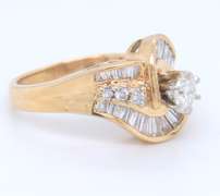 Sparkling Yellow Gold Round Brilliant Cut and Baguette Swirl Engagement Ring