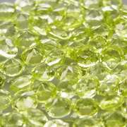 High grade 4.85ct untreated apple green Peridot set