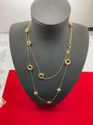 18K YELLOW GOLD STATION NECKLACE.