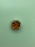 14K GOLD DIAMOND AND TOPAZ PENDANT.