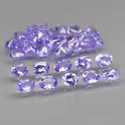 Glittering 5.33ct bright violet Tanzanite set