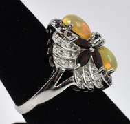 Sterling Silver Ring with Garnet and Opalescent Material