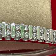 18KT WHITE GOLD DIAMOND BANGLE BRACELET.