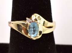 Sensational Topaz Swirl Ring in Yellow Gold