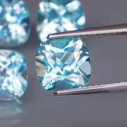 Large 10.06ct vivid blue cushion cut Topaz set