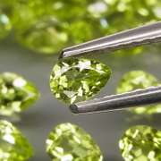 Dazzling 8.22ct untreated apple green pear shaped Peridot set