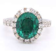 LADIES 14 KT GREEN TOURMALINE and DIAMOND RING.