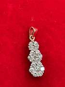 14K GOLD AND DIAMOND PENDANT.