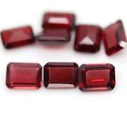 Nice 12.57ct emerald cut cherry red Garnet set