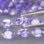 Glittering 5.33ct bright violet Tanzanite set