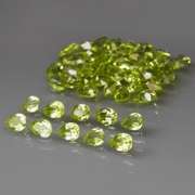 Dazzling 8.22ct untreated apple green pear shaped Peridot set