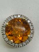 14K GOLD DIAMOND AND TOPAZ PENDANT.