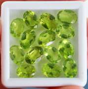 Superb 14 piece Peridot set weighing 10.40cts