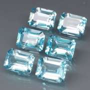 Large 11.31ct vivid blue emerald cut Topaz set