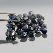 Stunning ink blue 7.14ct pear cut Sapphire set