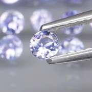 Heavy flashing 4.81ct round Tanzanite set