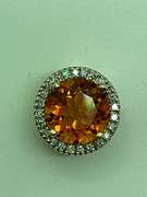 14K GOLD DIAMOND AND TOPAZ PENDANT.