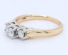 Brilliant Yellow Gold Three Stone Diamond Band