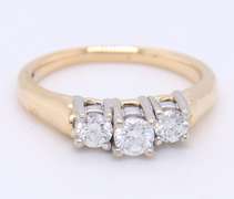 Brilliant Yellow Gold Three Stone Diamond Band