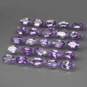 Heavy flashing 5.05ct oval cut Tanzanite set