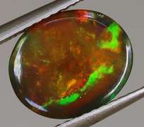 Magnificent 2.05ct full body flashing Black Opal