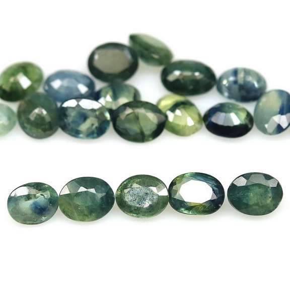 Heated only! 7.58ct blue green Sapphire set