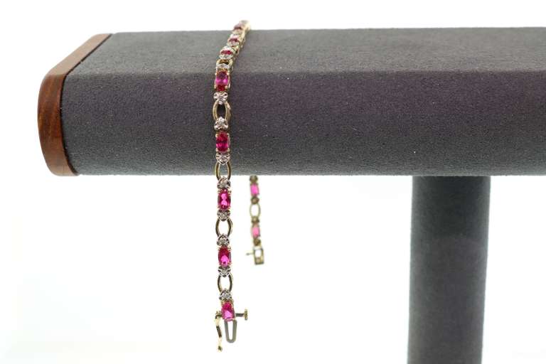 LADIES RUBIES AND DIAMOND GOLD BRACELET.