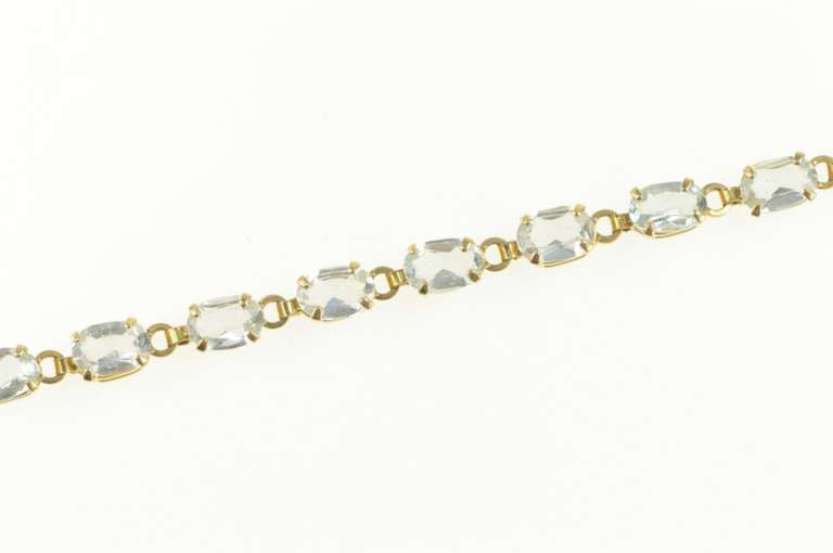 14K Yellow Gold Oval Sim. Blue Topaz Classic Tennis Bracelet