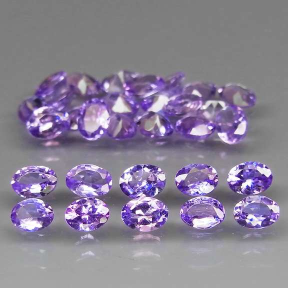 Heavy flashing 4.43ct oval cut Tanzanite set