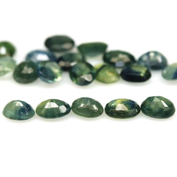 Heated only! 7.58ct blue green Sapphire set