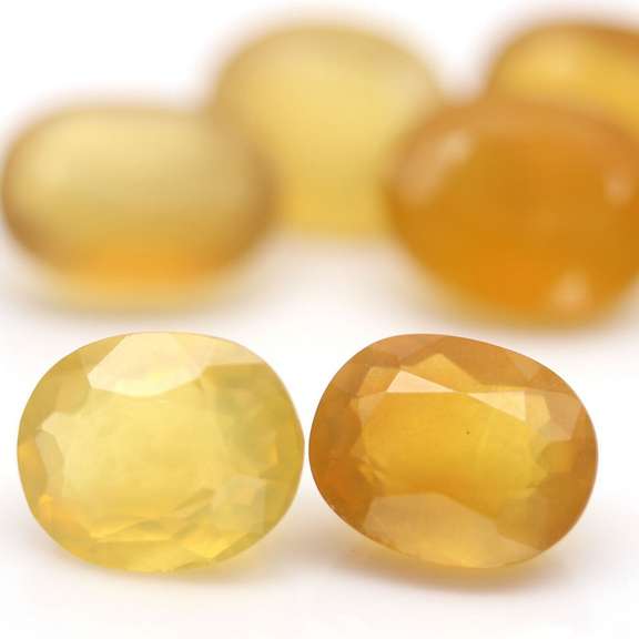 Glistening 25.71ct natural golden Fire Opal set